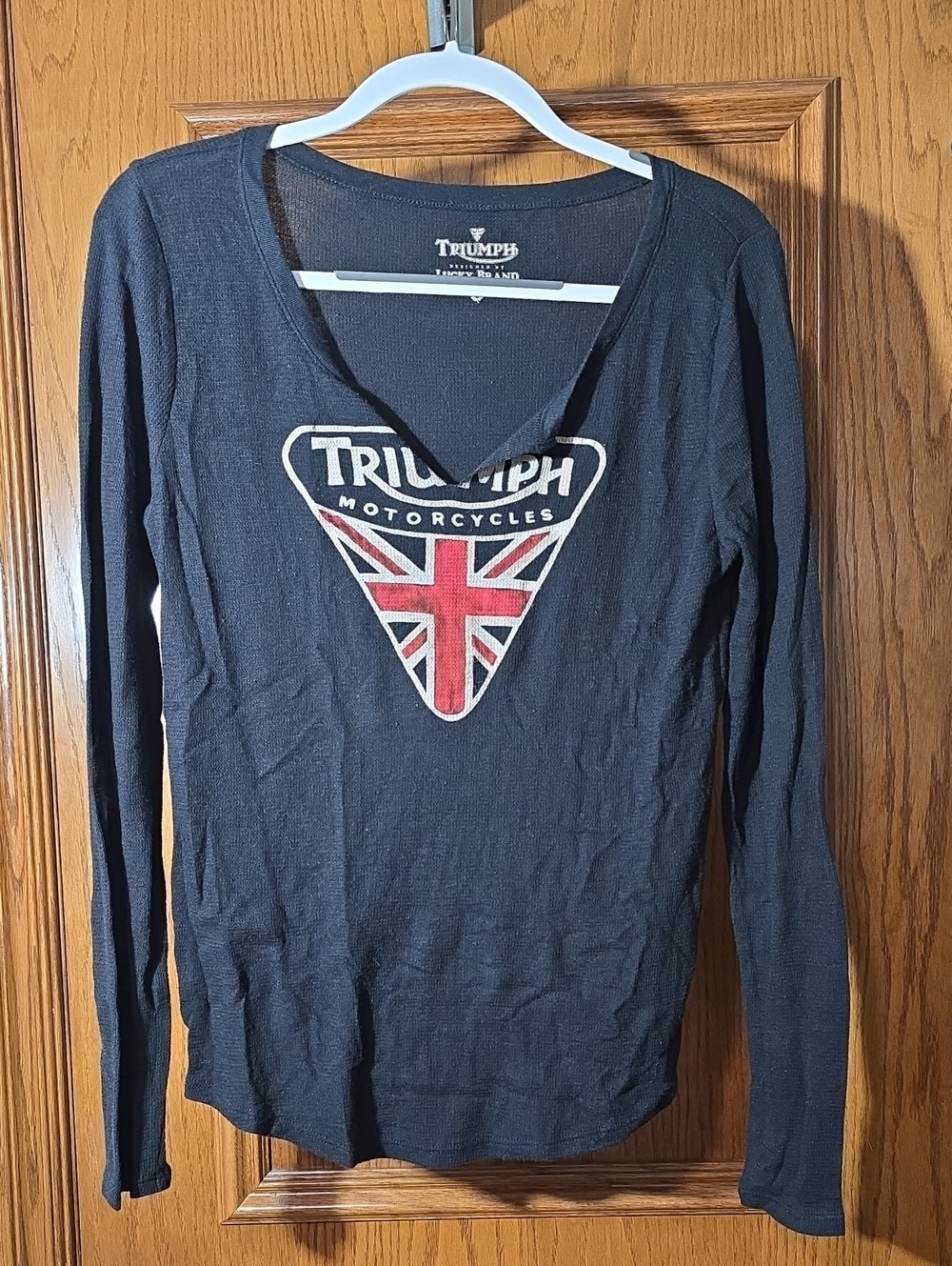 Luck Brand Triumph Black Long Sleeve V-Neck Top with Red & White Crest